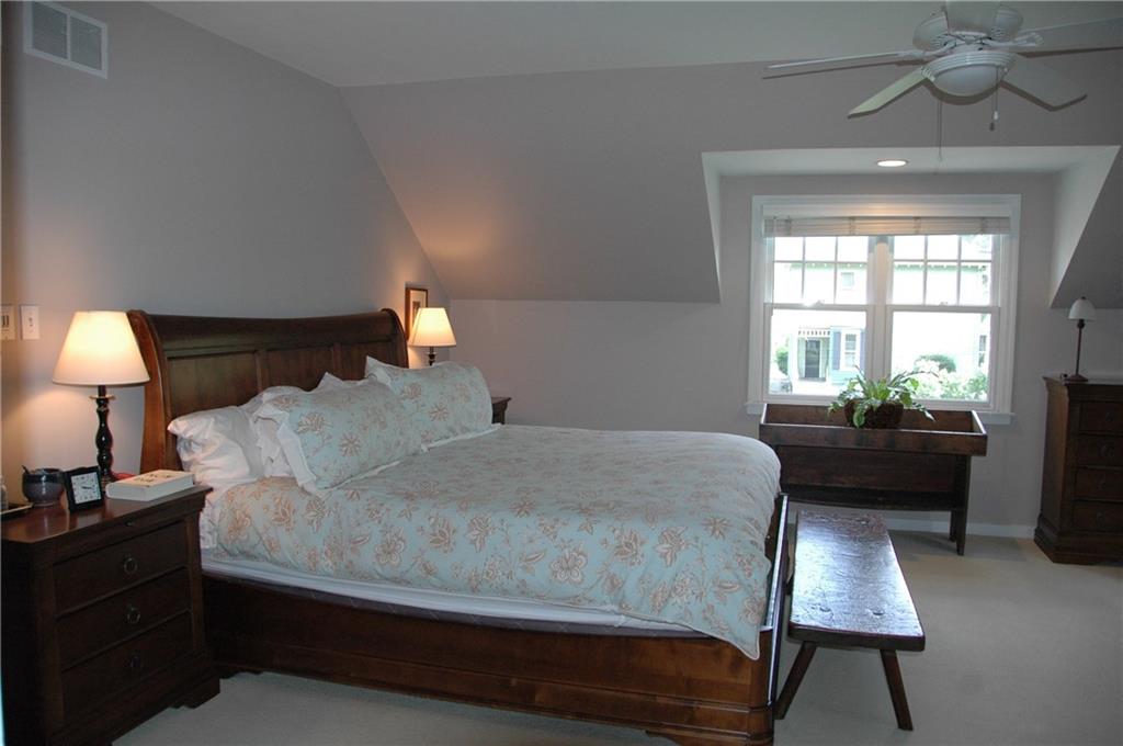 303 Pine Road Edgeworth, PA 15143 - Photo 13 of 24 a bedroom with a bed and a lamp next to a window