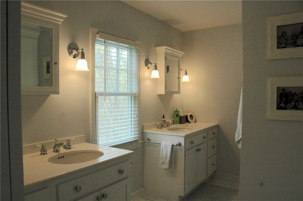303 Pine Road Edgeworth, PA 15143 - Photo 15 of 24 a bathroom with a sink vanity and mirror