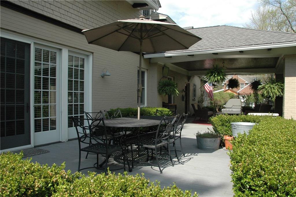 303 Pine Road Edgeworth, PA 15143 - Photo 23 of 24 a view of a patio with table and chairs under an umbrella