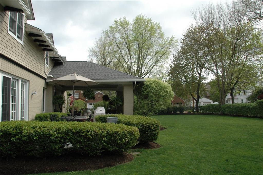 303 Pine Road Edgeworth, PA 15143 - Photo 24 of 24 Terrace opens to large, flat, fenced yard with lovely landscaping. There is a sunny side yard with planting beds.