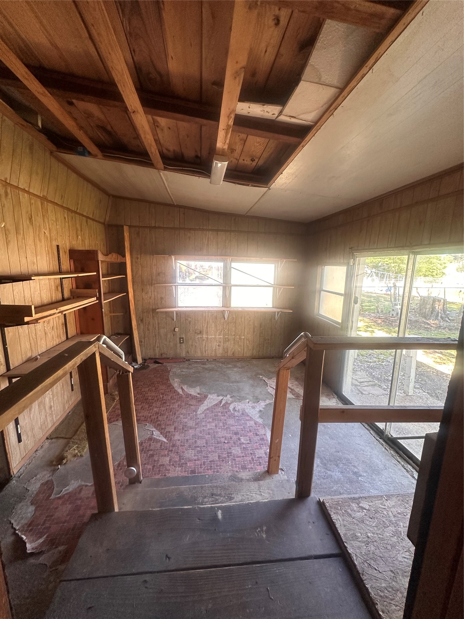 1607 Klauke Street Rosenberg, TX 77471 - Photo 13 of 17 a view of an empty room with wooden floor and windows