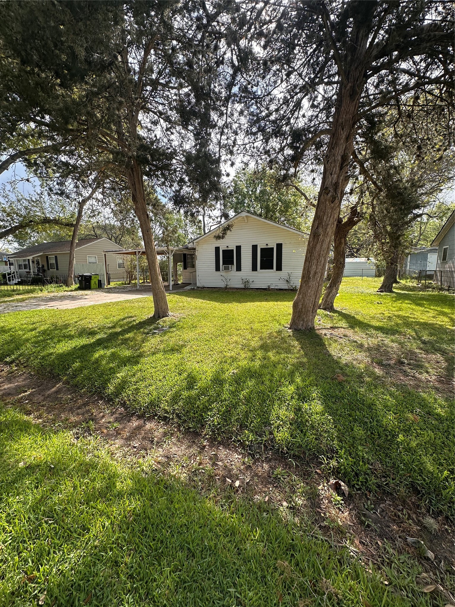 1607 Klauke Street Rosenberg, TX 77471 - Photo 2 of 17 a house with huge green field in front of it