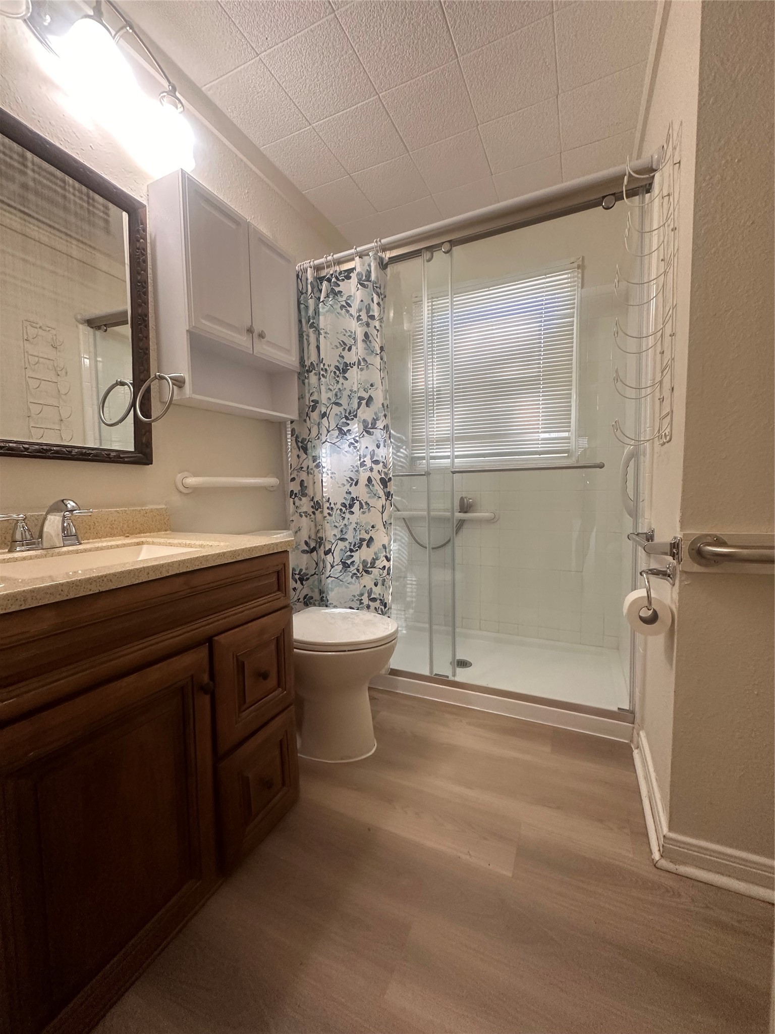 1607 Klauke Street Rosenberg, TX 77471 - Photo 9 of 17 a bathroom with a granite countertop sink toilet and shower