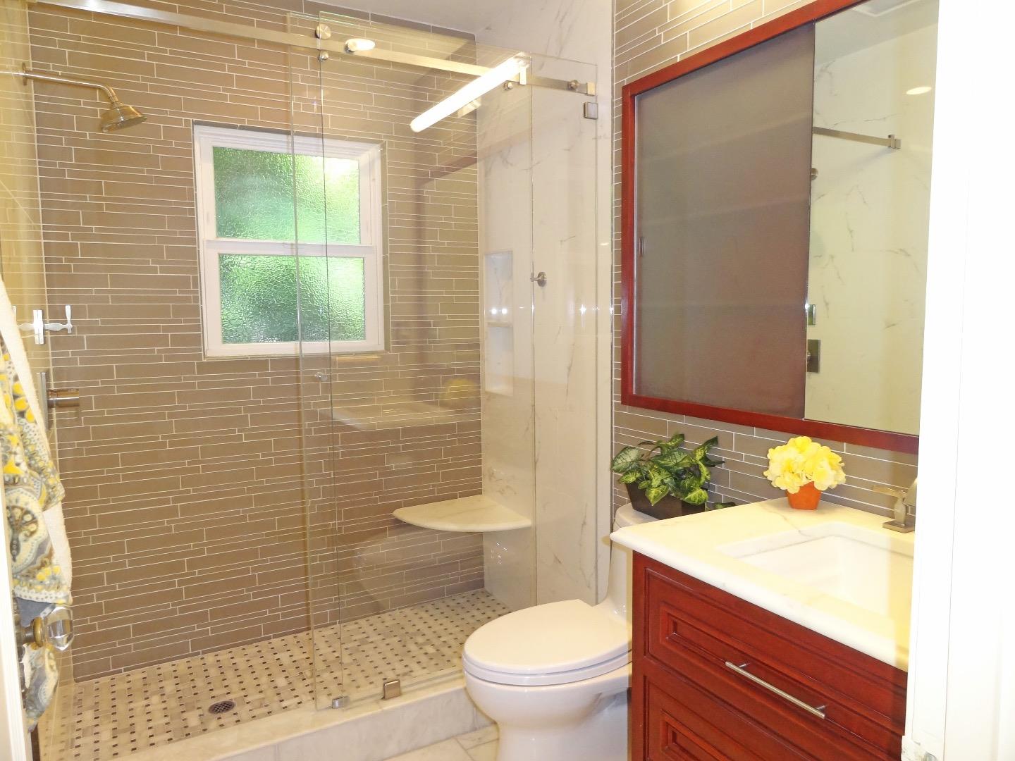 16760 Magneson Loop Los Gatos, CA 95032 - Photo 13 of 20 a bathroom with a granite countertop sink toilet and shower