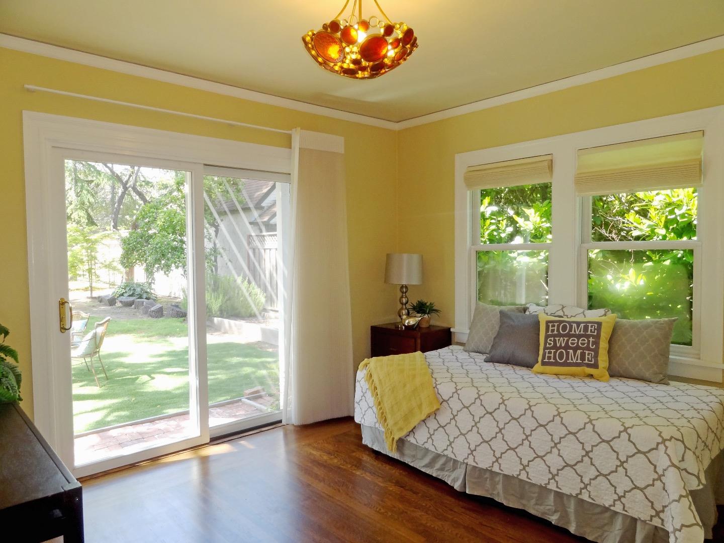 16760 Magneson Loop Los Gatos, CA 95032 - Photo 14 of 20 a bedroom with a bed and a large window