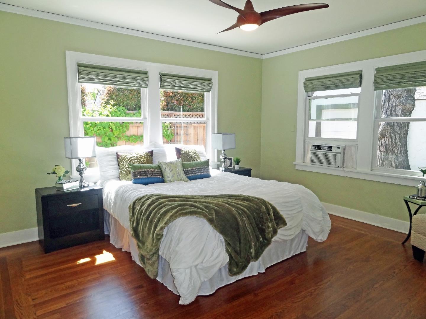 16760 Magneson Loop Los Gatos, CA 95032 - Photo 16 of 20 a spacious bedroom with a bed and a dresser next to a window