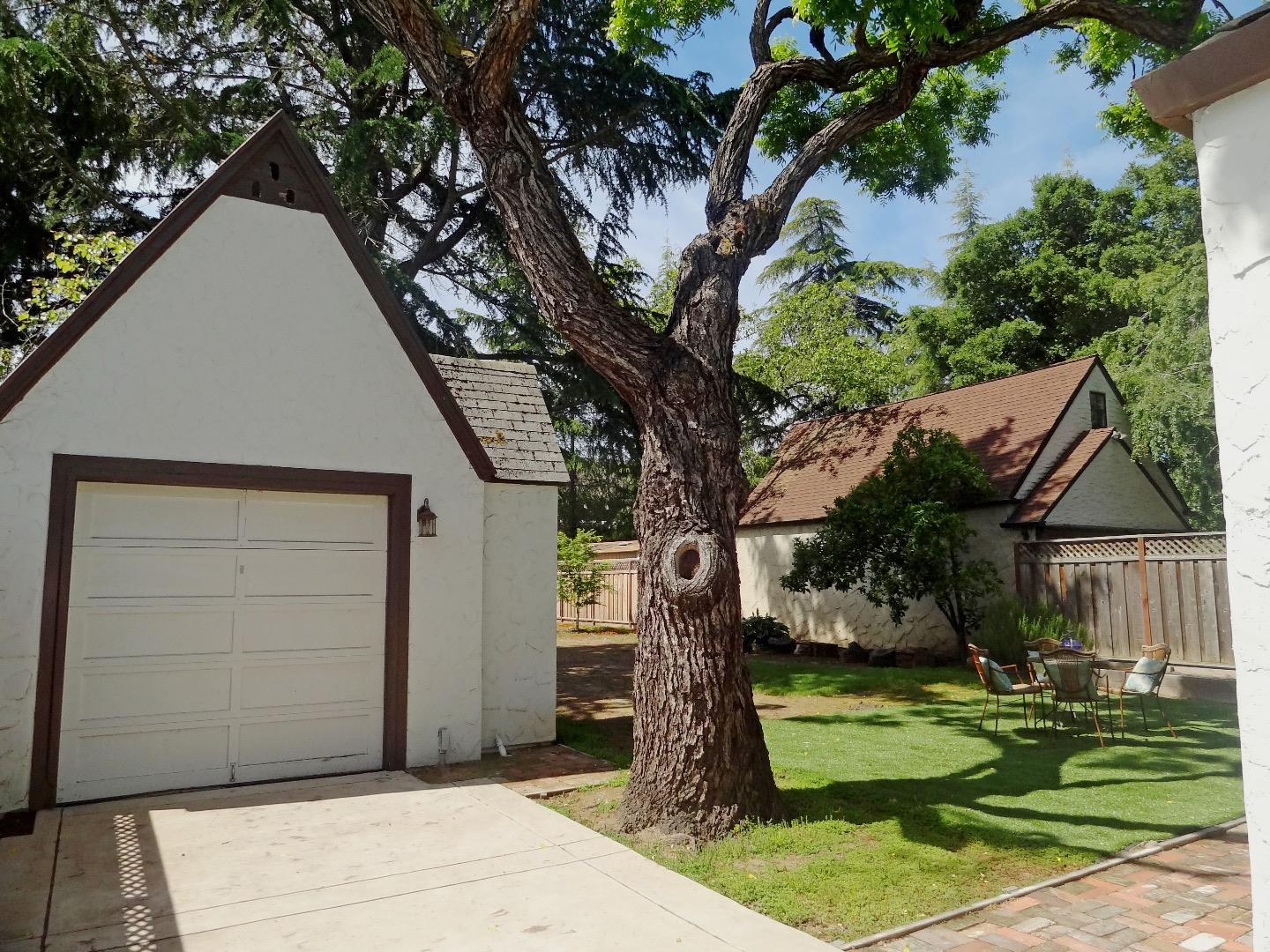 16760 Magneson Loop Los Gatos, CA 95032 - Photo 18 of 20 a backyard of a house with plants and large tree