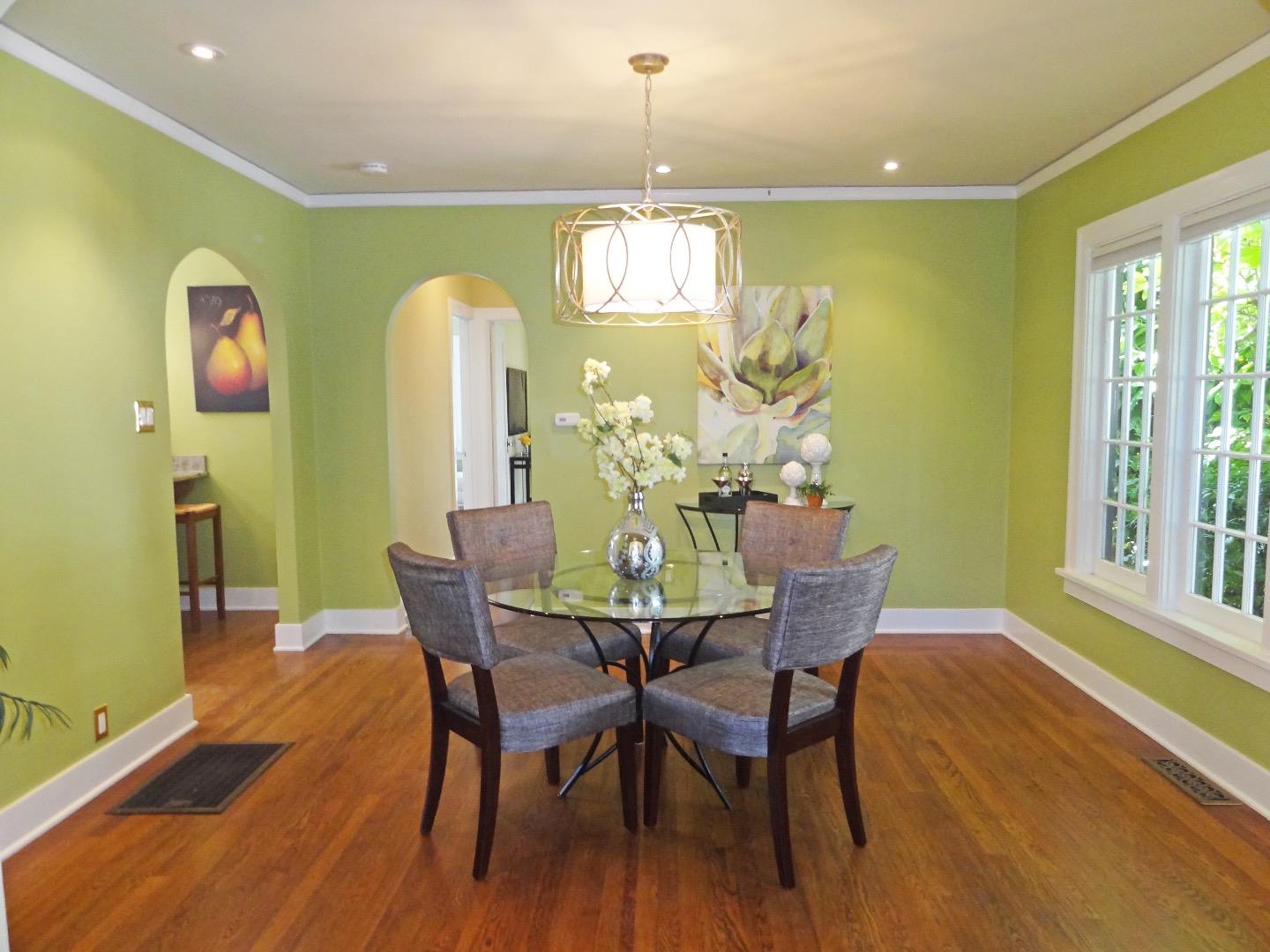 16760 Magneson Loop Los Gatos, CA 95032 - Photo 10 of 20 a dining room with furniture a potted plant and wooden floor