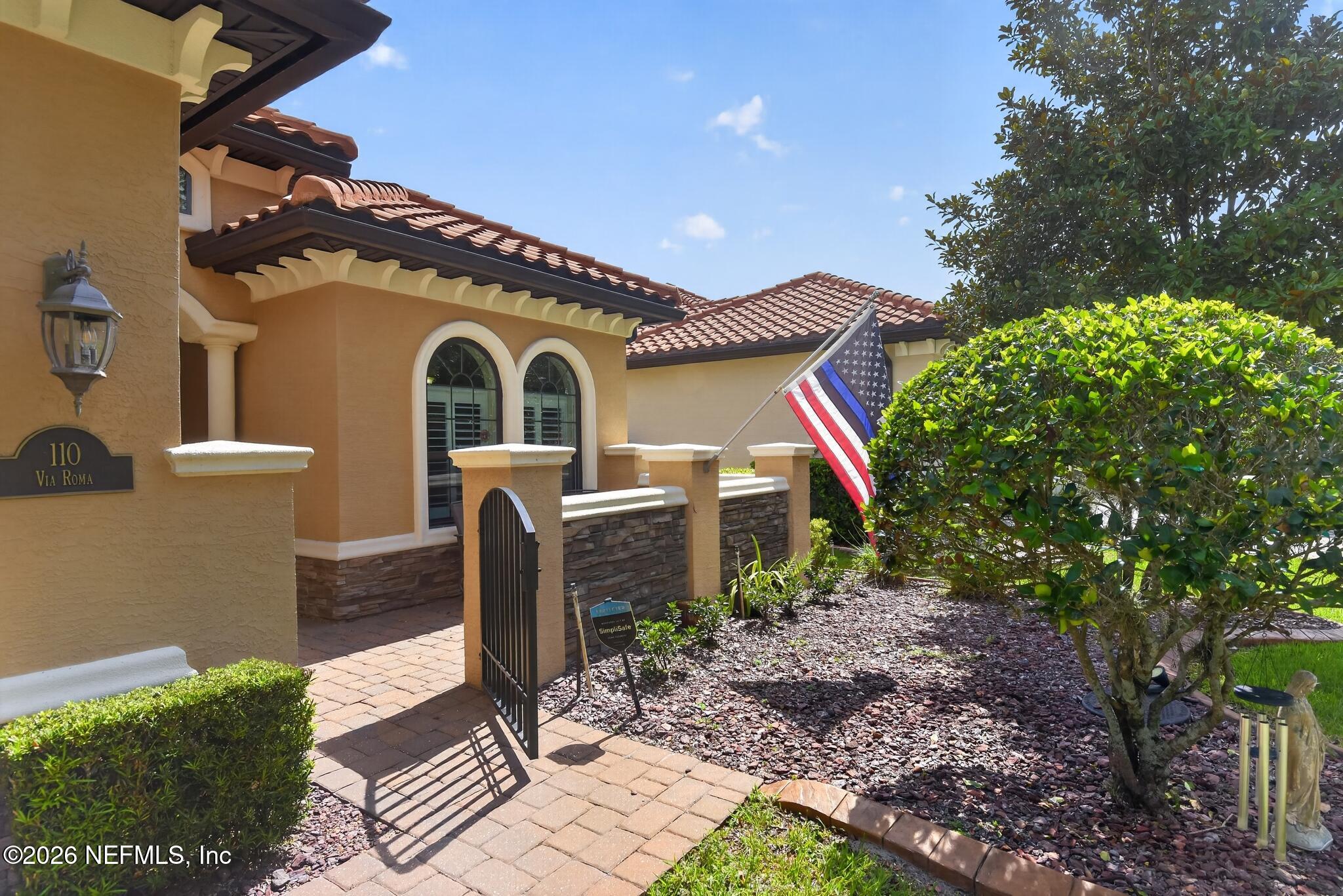 110 Vía Roma Ormond Beach, FL 32174 - Photo 43 of 43 a front view of a house with garden