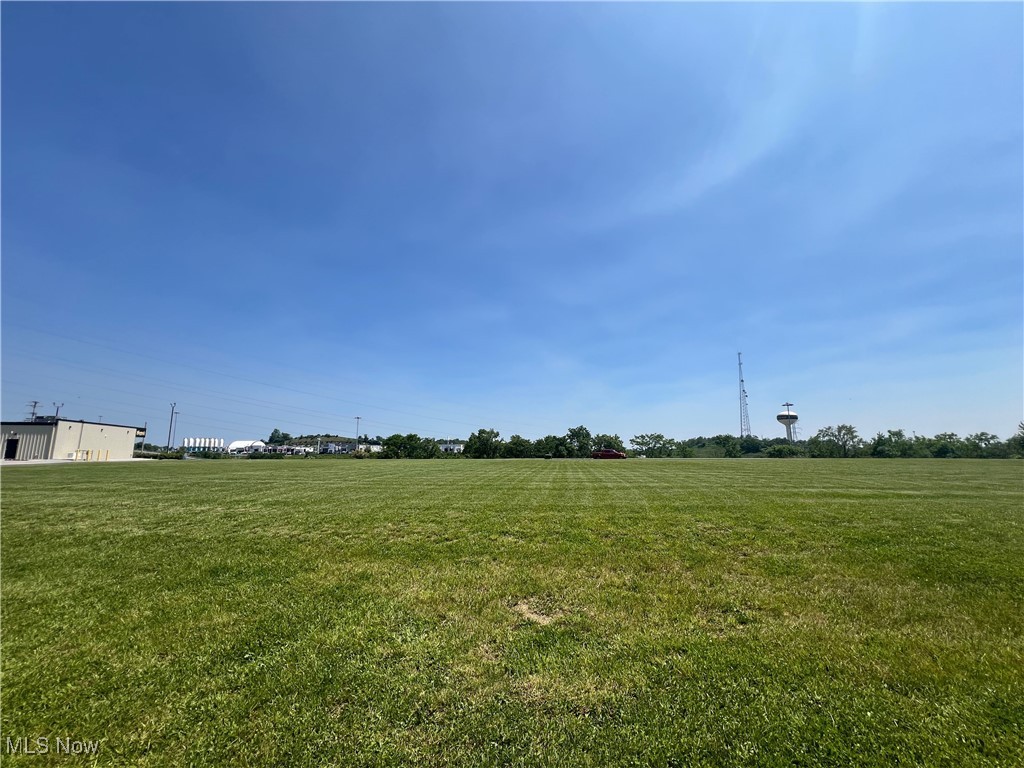 View of green lawn with a view of rural / pastoral area