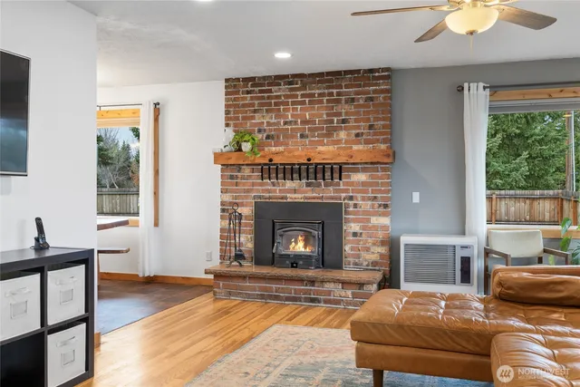 a bathroom with a granite countertop sink and a shower