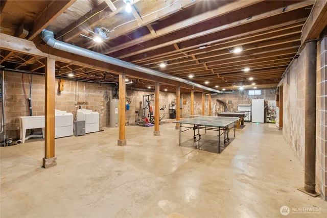 a view of a ocean with couches chairs and a table