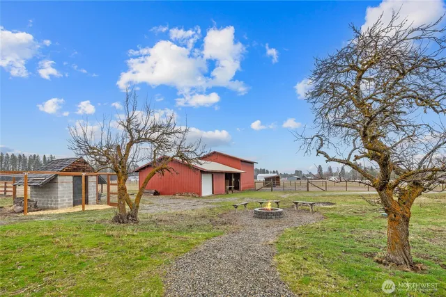 a view of a wooden door with a backyard