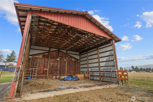 a view of a room with wooden walls and stairs