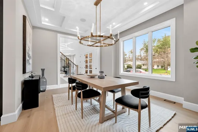 a spacious bedroom with a bed and a large window