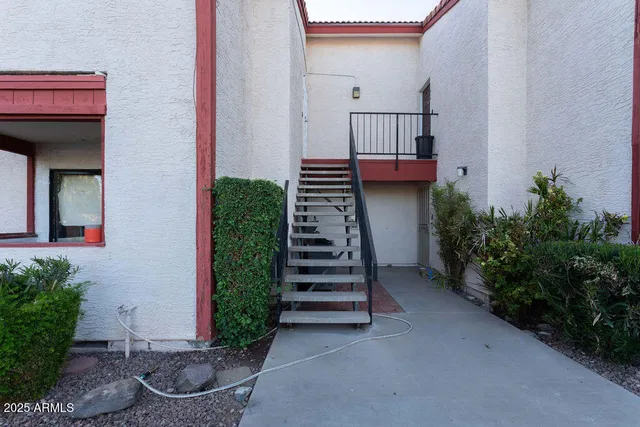 a view of a swimming pool with a lounge chairs