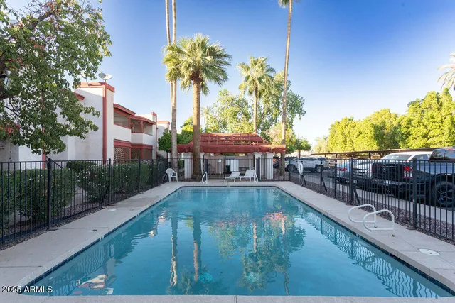 a view of a porch with furniture and a yard
