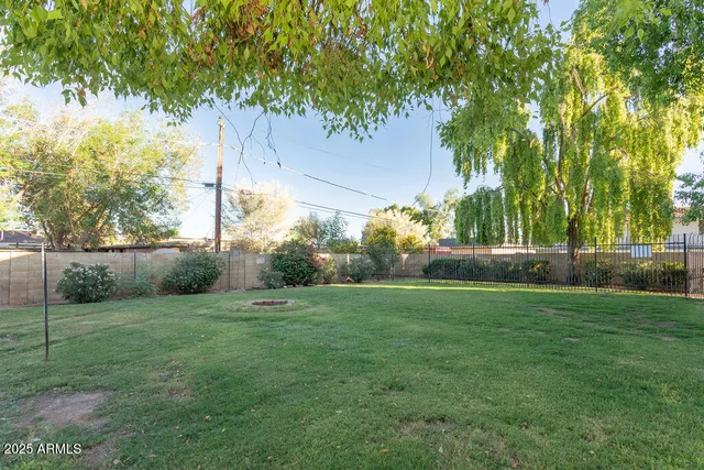a view of a tree in front of a house