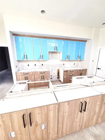 a view of kitchen with wooden floor