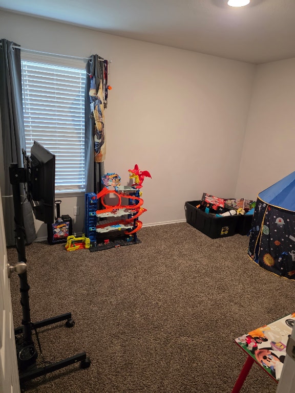 1124 Velvet Court Troy, TX 76579 - Photo 12 of 18 a bedroom with furniture and a flat screen tv