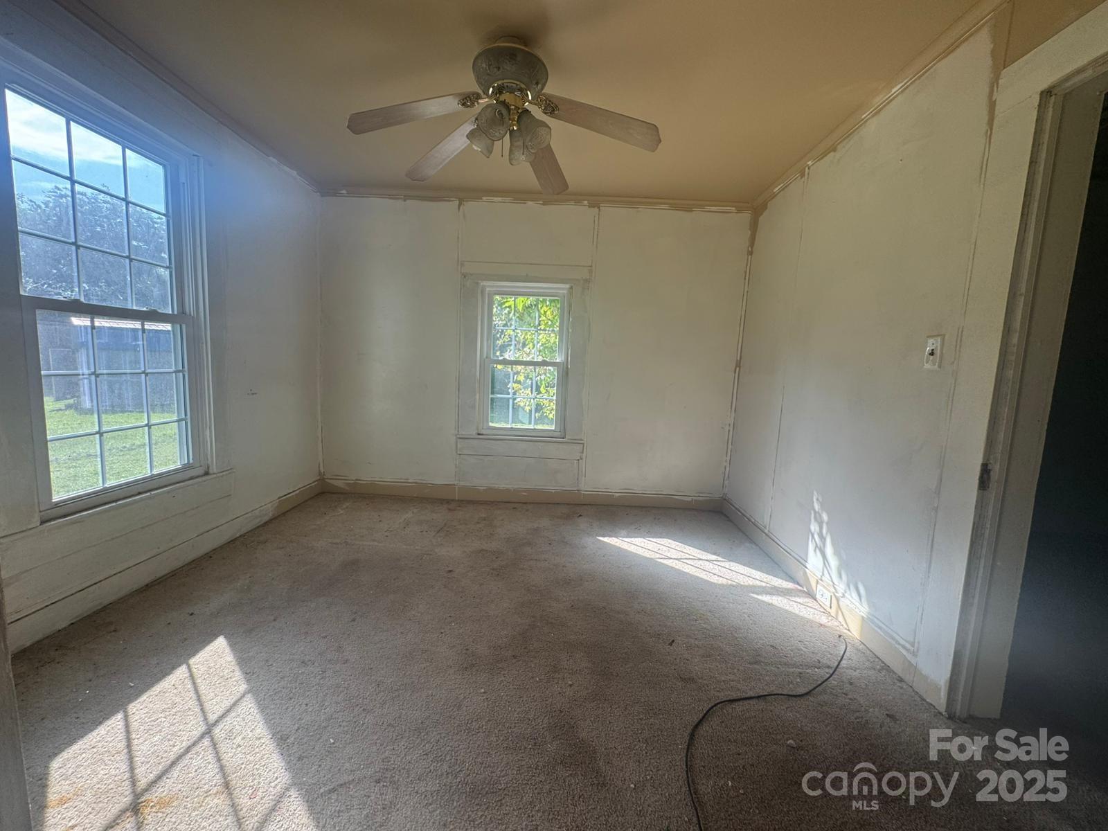 65 Maynard Avenue Ansonville, NC 28170 - Photo 4 of 14 a view of an empty room with a window