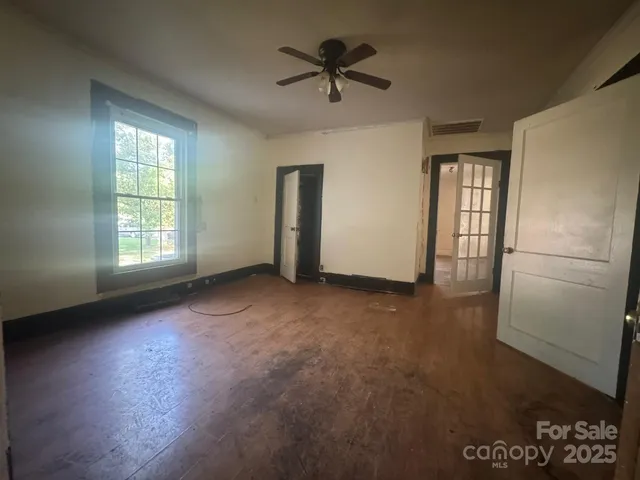 a large kitchen with cabinets and a fireplace