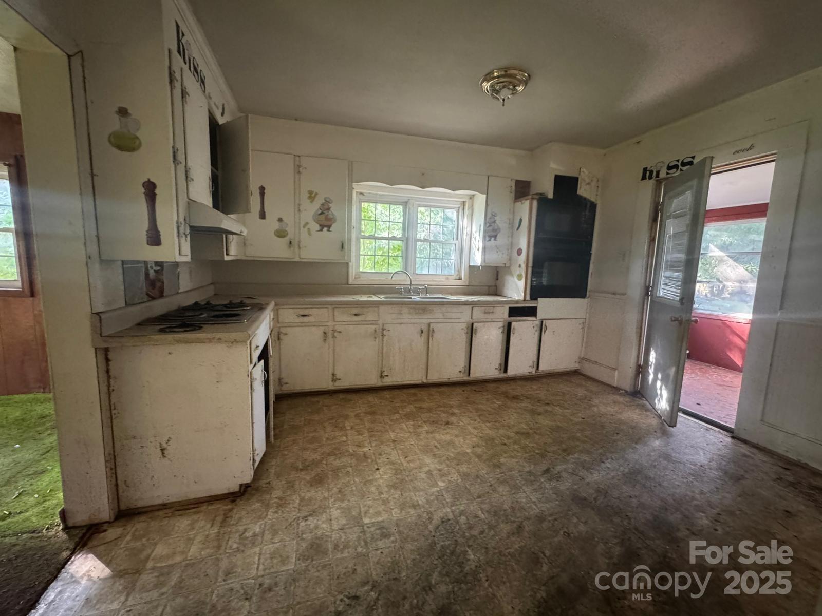 65 Maynard Avenue Ansonville, NC 28170 - Photo 8 of 14 a view of a kitchen with a sink