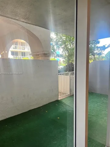 a view of yard from a balcony