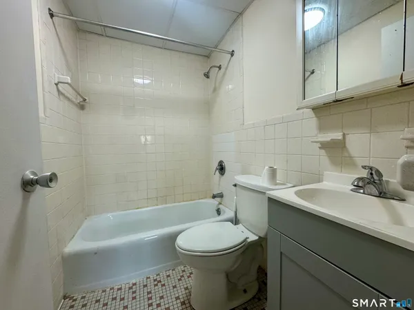 a bathroom with a sink a toilet and a bathtub