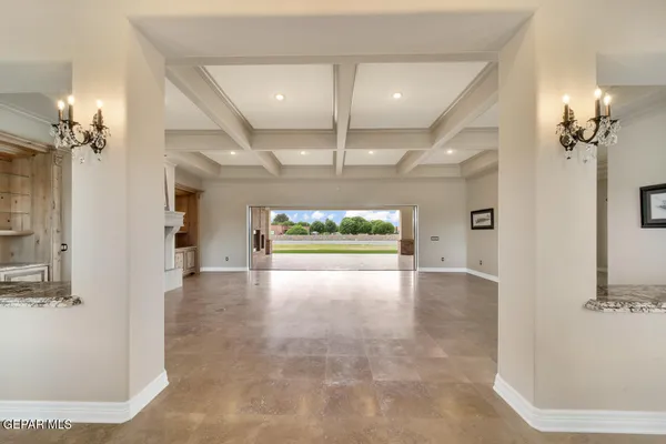 a kitchen with stainless steel appliances granite countertop a sink a counter space and a window