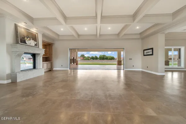 a kitchen with kitchen island granite countertop a sink a counter space appliances and cabinets
