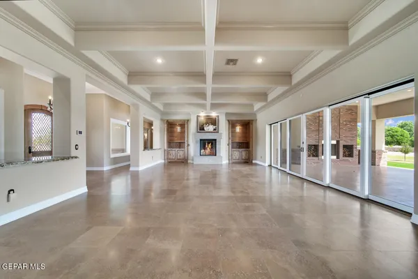 a living room with stainless steel appliances kitchen island granite countertop furniture and a kitchen view