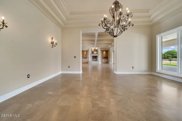 a kitchen with stainless steel appliances kitchen island granite countertop a refrigerator oven a sink dishwasher and white cabinets with wooden floor