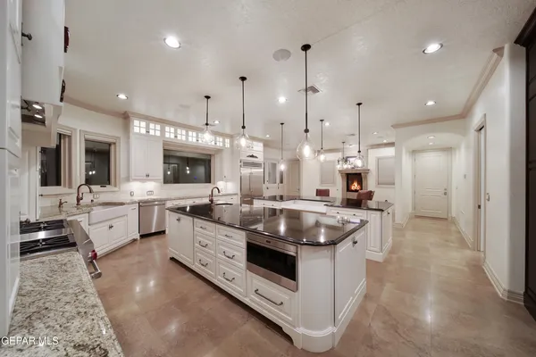 a view of a livingroom with a hardwood floor and a ceiling fan