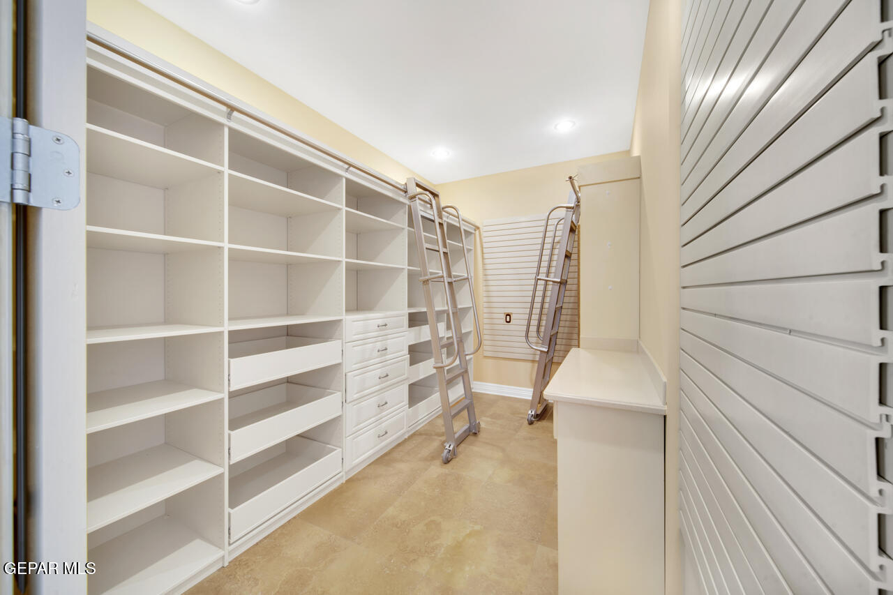 7 Cielo Del Este Anthony, NM 88021 - Photo 38 of 95 a view of walk in closet with empty racks