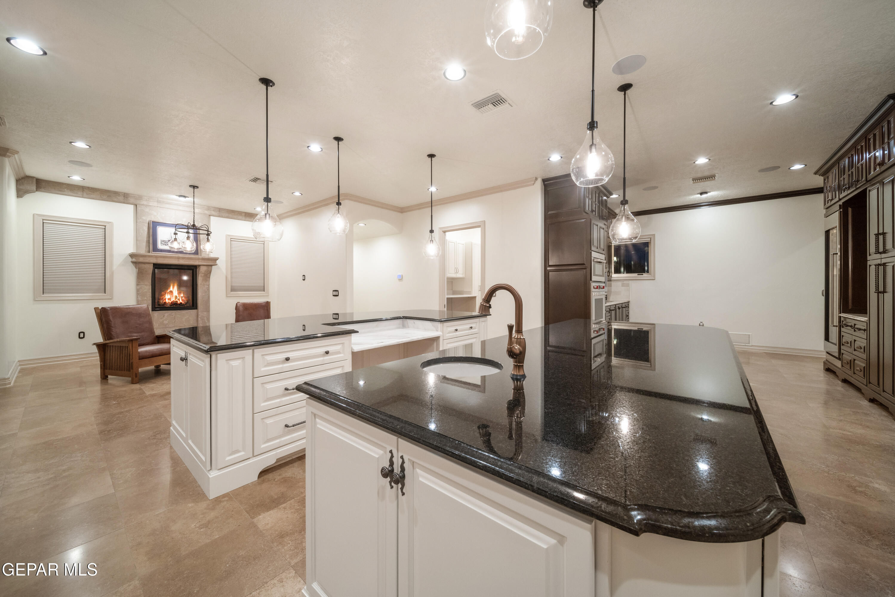 7 Cielo Del Este Anthony, NM 88021 - Photo 41 of 95 a kitchen with stainless steel appliances granite countertop a sink a refrigerator and a counter top space