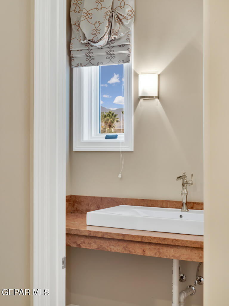 7 Cielo Del Este Anthony, NM 88021 - Photo 48 of 95 a bathroom with a sink and a mirror