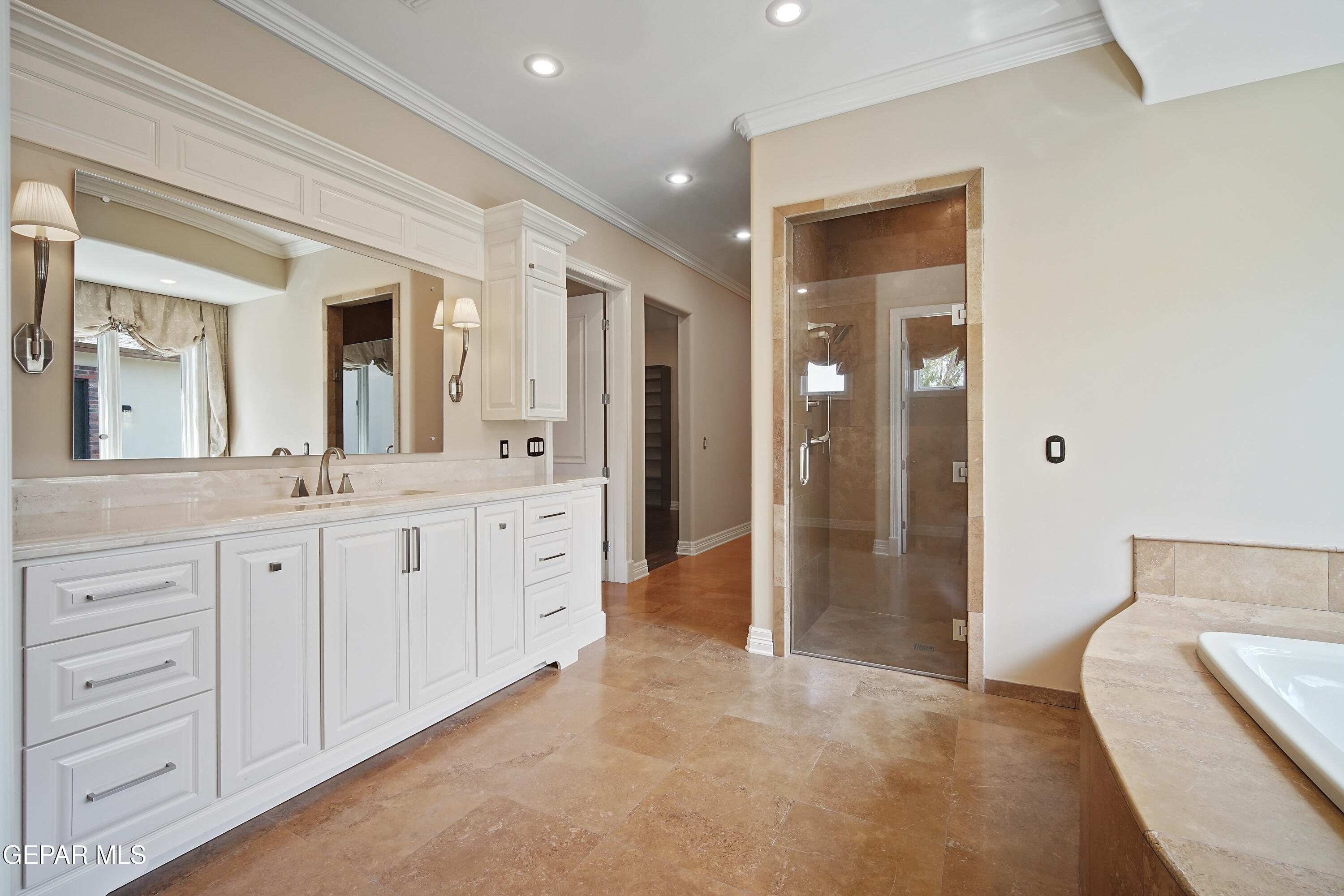 7 Cielo Del Este Anthony, NM 88021 - Photo 62 of 95 a spacious bathroom with a double vanity sink shower and a mirror