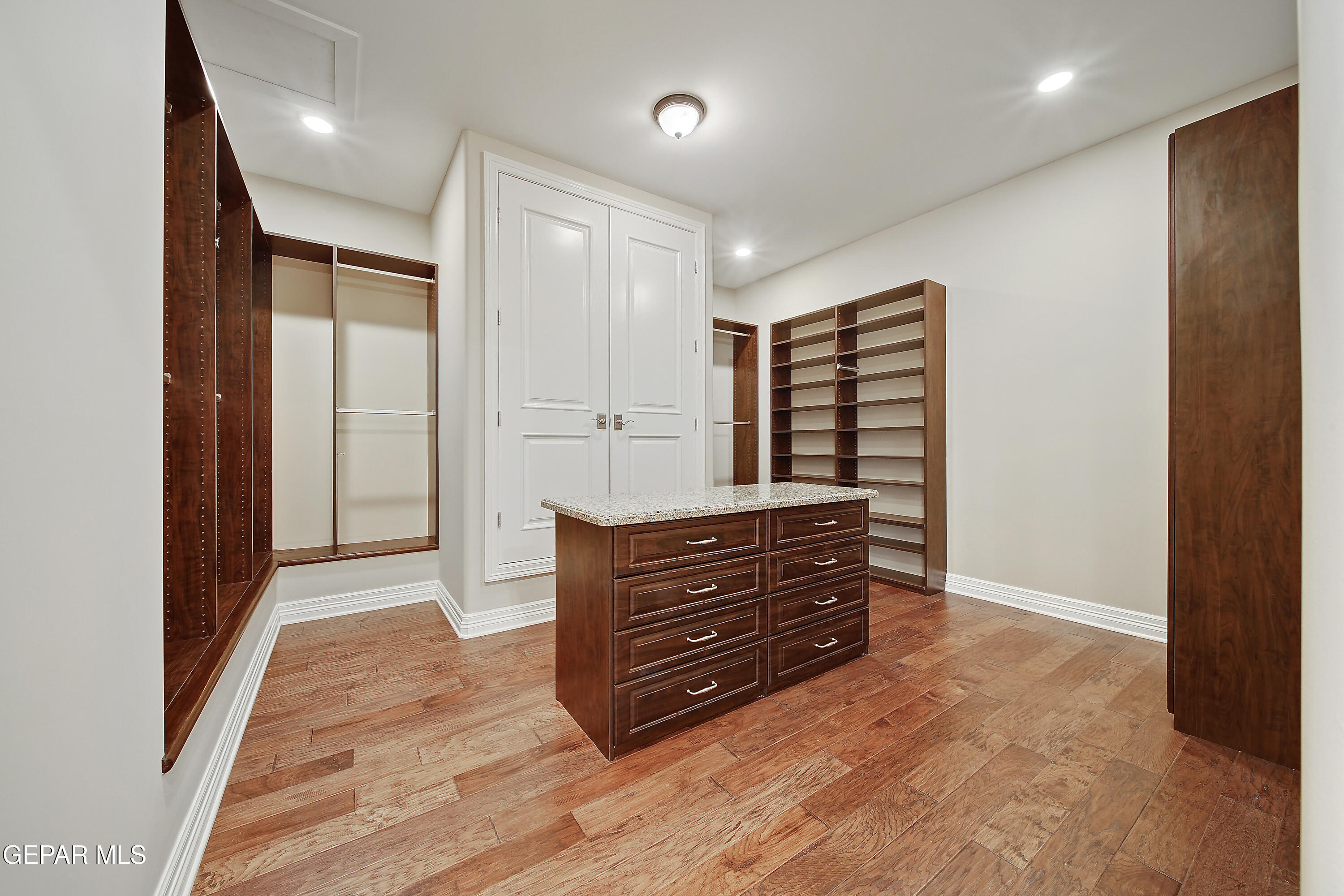 7 Cielo Del Este Anthony, NM 88021 - Photo 63 of 95 a view of walk in closet with clothes and shoes