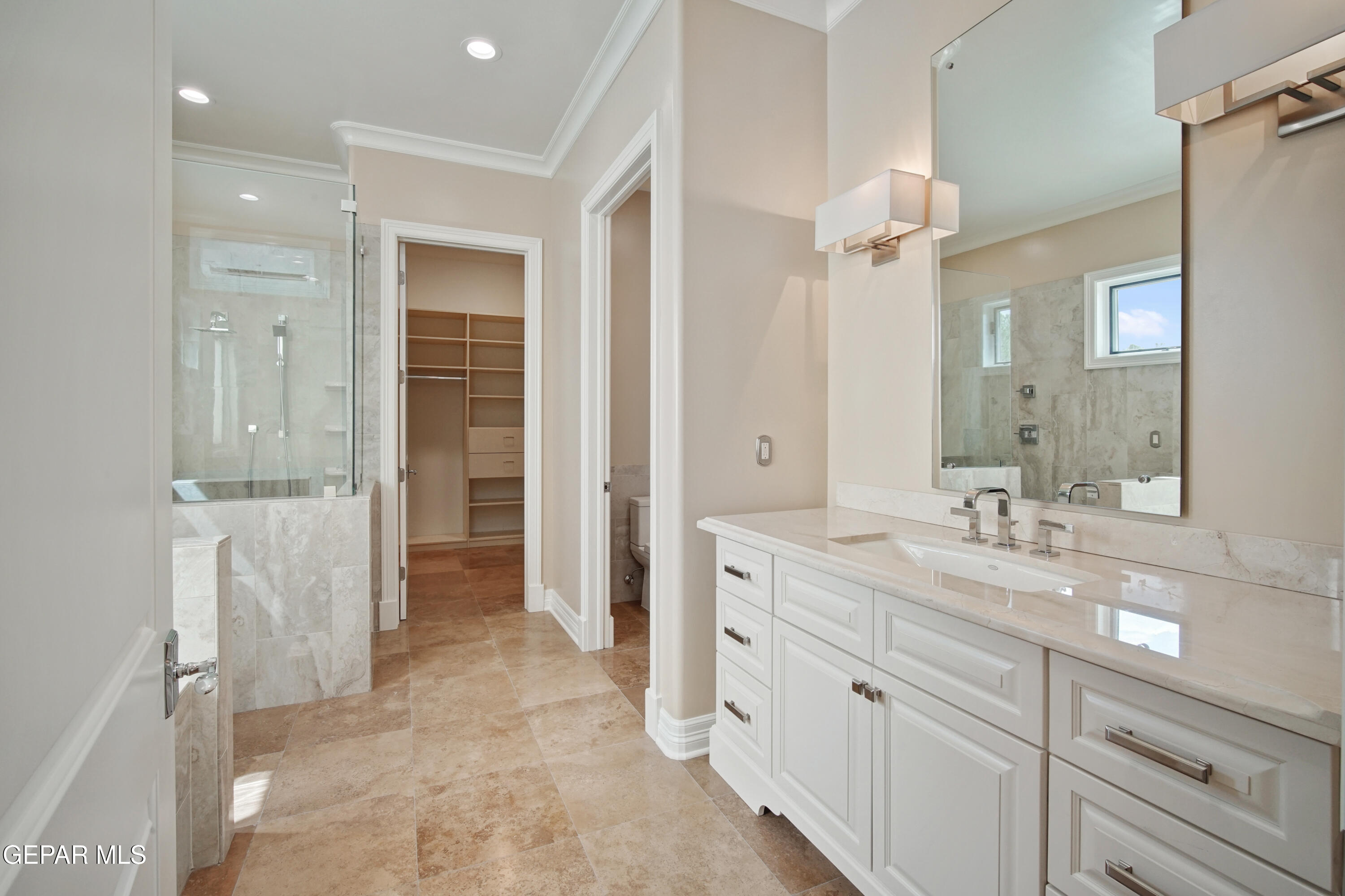 7 Cielo Del Este Anthony, NM 88021 - Photo 73 of 95 a spacious bathroom with a granite countertop sink mirror and a shower
