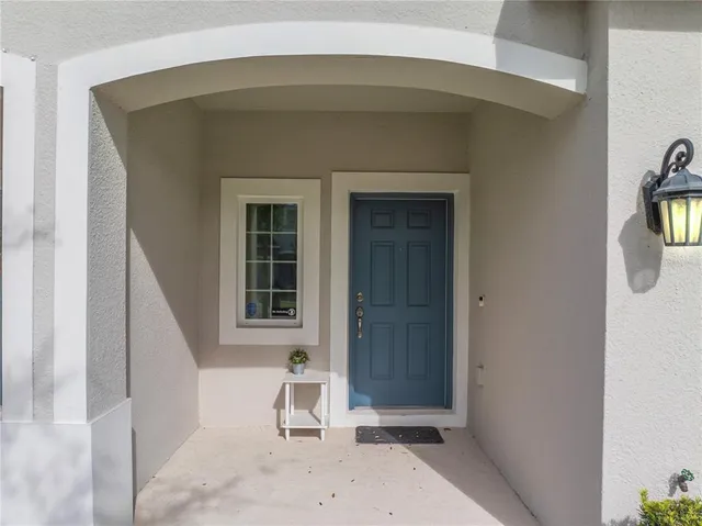 a bench sitting in front of a house