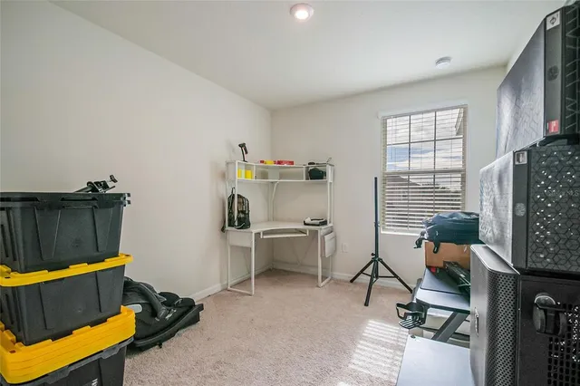 a bedroom with furniture and a window