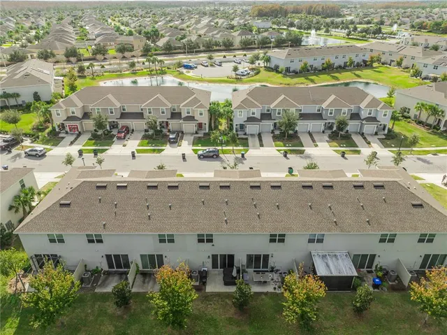 an aerial view of a city with lawn chairs