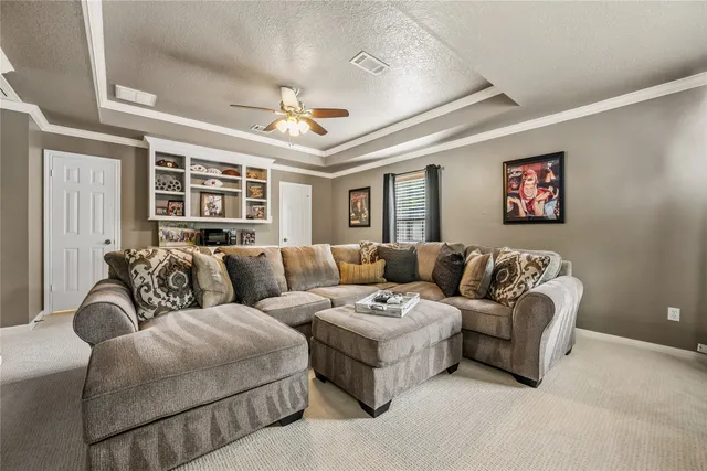 a room with pool table and windows