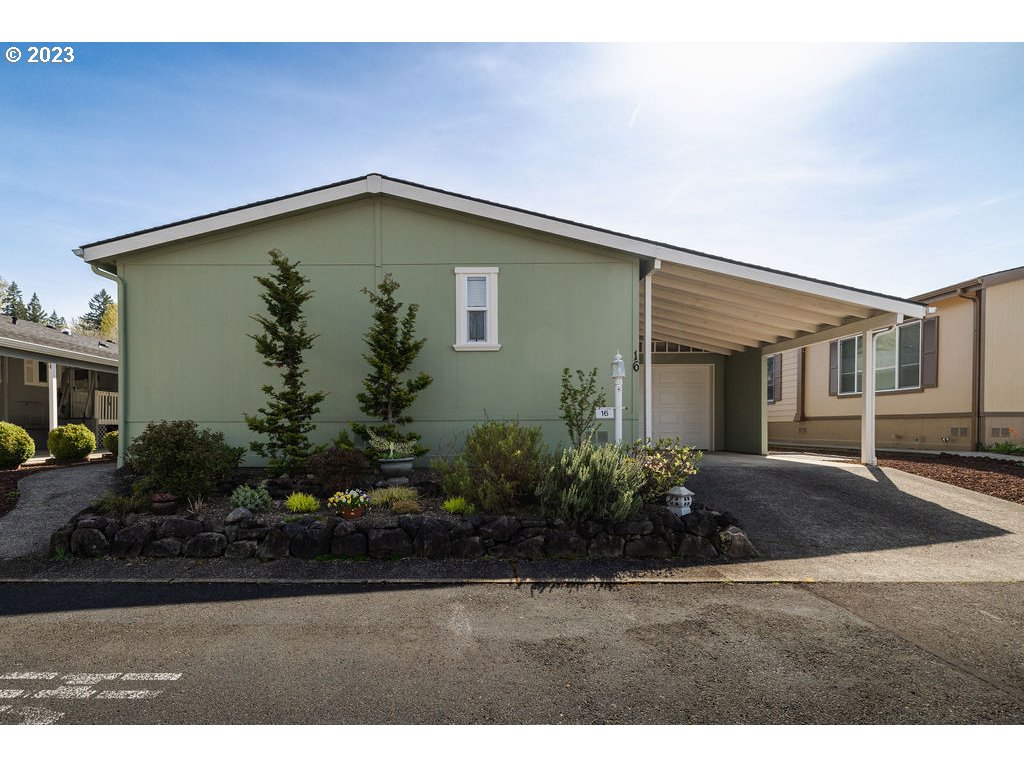 a backyard of a house with plants