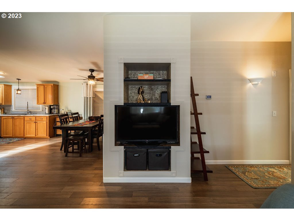 369 Gun Club Road, Unit 16 Woodland, WA 98674 - Photo 11 of 44 a living room with furniture and a flat screen tv