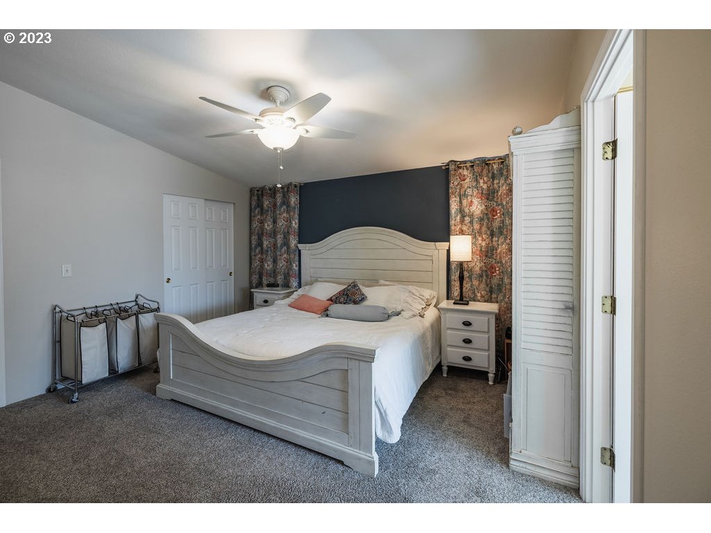 369 Gun Club Road, Unit 16 Woodland, WA 98674 - Photo 17 of 44 a living room with a bed furniture and a window