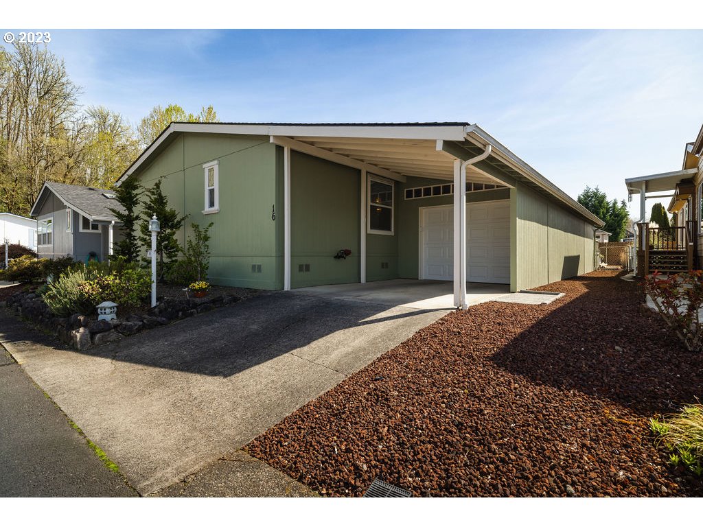 369 Gun Club Road, Unit 16 Woodland, WA 98674 - Photo 2 of 44 a front view of a house with garden
