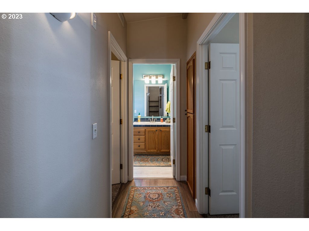 369 Gun Club Road, Unit 16 Woodland, WA 98674 - Photo 22 of 44 a view of a bathroom from a hallway