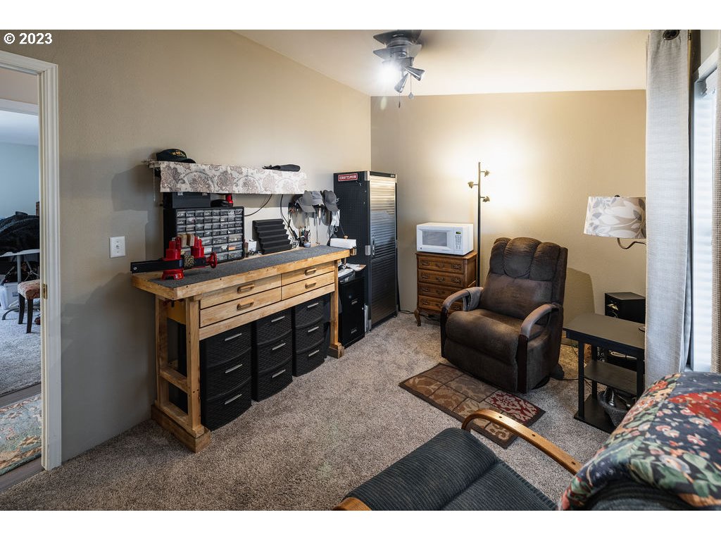 369 Gun Club Road, Unit 16 Woodland, WA 98674 - Photo 25 of 44 a living room with furniture and a fireplace